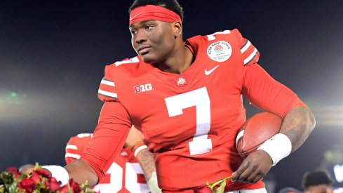 Haskins grabs a rose after his Bowl victory