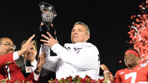 Urban Meyer hoists the Rose Bowl trophy after Ohio State defeated Washington in Pasadena.
