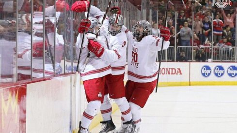 Tanner Laczynski and Matt Miller celebrate a goal in the Buckeyes' win over Michigan.