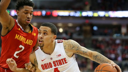 Duane Washington drives against a Maryland defender