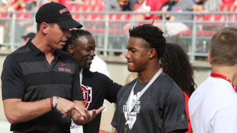 WR coach Brian Hartline talks to a recruit