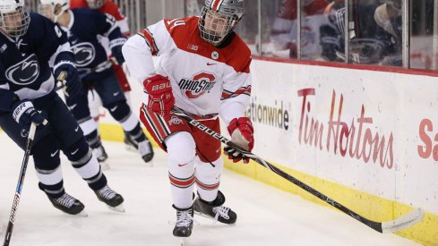 Buckeye forward Austin Pooley makes a pass in a game against Penn State.