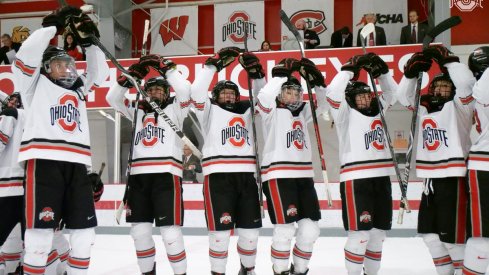 The women's hockey Buckeyes celebrate a home win.