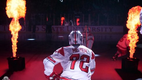 Columbus Blue Jackets prospect Carson Meyer leads the Buckeyes onto the ice.