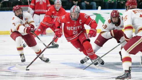 Buckeye captain Mason Jobst splits the Denver defense in the West Regional of the 2019 NCAA men's hockey tournament.