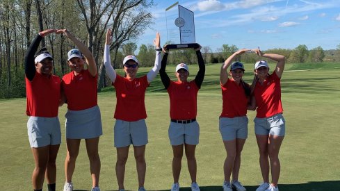 Women's golf celebrates its Big Ten title. 