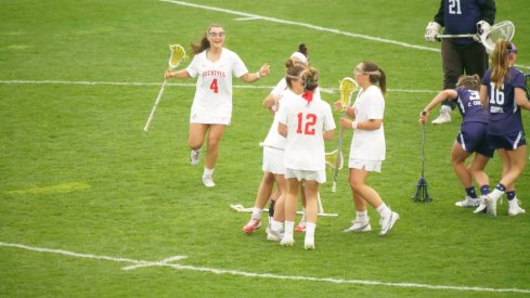 Women's lacrosse celebrates a goal against Northwestern