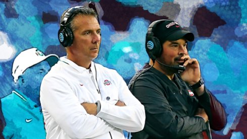 Sep 22, 2018; Columbus, OH, USA; Ohio State Buckeyes head coach Urban Meyer (center) watches the game from the sidelines with assistant coach Ryan Day (right) and assistant coach Tony Alford (left) during the third quarter against the Ohio State Buckeyes at Ohio Stadium. Mandatory Credit: Joe Maiorana-USA TODAY Sports