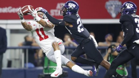 Austin Mack stretches out against TCU. 