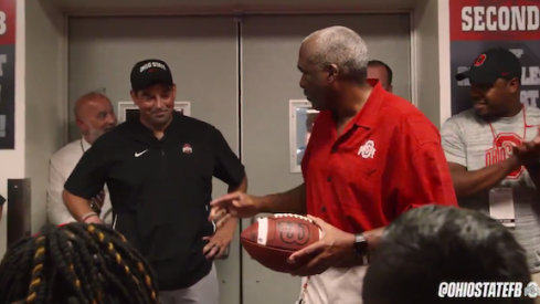 Gene Smith gives Ryan Day the game ball.