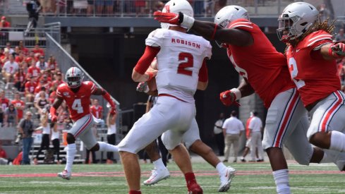 Jashon Cornell and Chase Young get to the quarterback. 