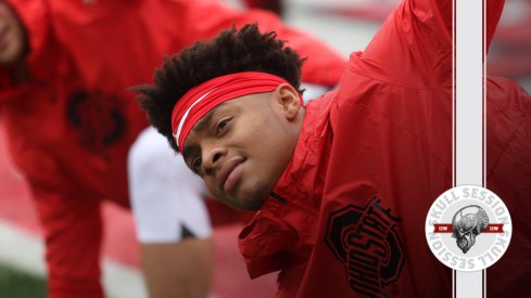 Justin Fields is stretching in today's skull session.