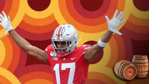 Sep 21, 2019; Columbus, OH, USA; Ohio State Buckeyes wide receiver Chris Olave (17) scores a touchdown as he is lifted by Ohio State Buckeyes offensive lineman Thayer Munford (75) during the first half against the Miami (Oh) Redhawks at Ohio Stadium. Mand