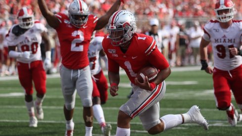 J.K. Dobbins celebrates as Justin Fields scores a touchdown.