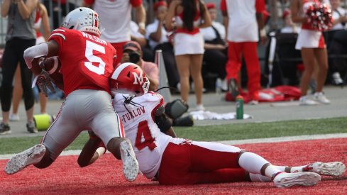 Garrett Wilson catches a touchdown pass against Miami.