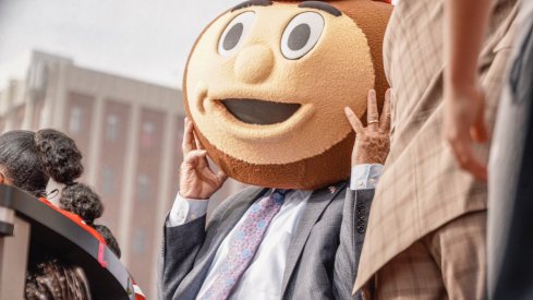 Corso wearing the Brutus headgear as he selects Ohio State in tonight's game. 