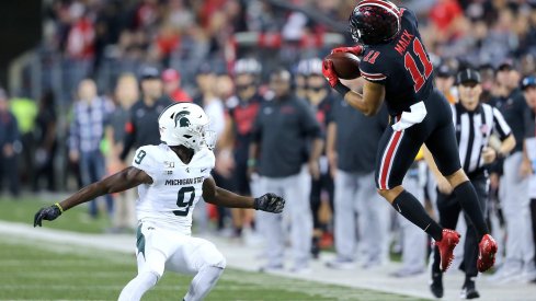 Austin Mack hauls in a back-shoulder fade to convert a third down against the Spartans.