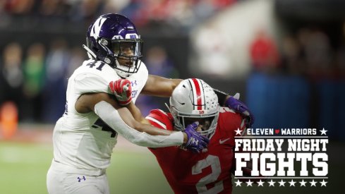 Dec 1, 2018; Indianapolis, IN, USA; Ohio State Buckeyes running back J.K. Dobbins (2) is tackled by Northwestern Wildcats safety Jared McGee (41) during the fourth quarter in the Big Ten conference championship game at Lucas Oil Stadium. Mandatory Credit: Brian Spurlock-USA TODAY Sports