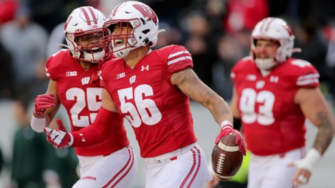 Zack Baun celebrates his interception return touchdown against Michigan State.