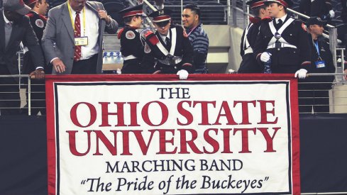 Members set up the Marching Band banner.