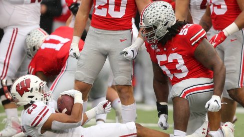 Wisconsin's Jonathan Taylor gets tackled