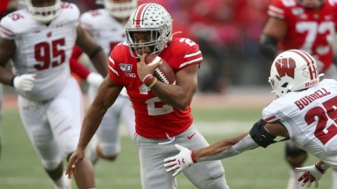 J.K. Dobbins tallied 221 total yards and two touchdowns in Ohio State's win over Wisconsin, dwarfing Jonathan Taylor's production.