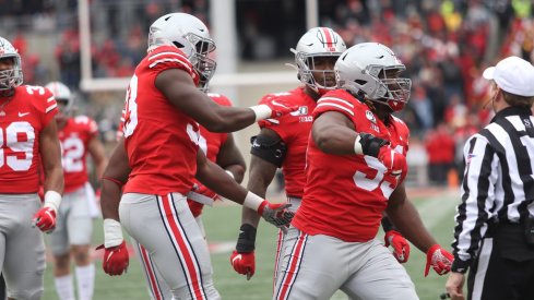 The defensive line celebrates a big play. 