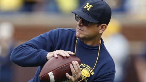 Sep 28, 2019; Ann Arbor, MI, USA; Michigan Wolverines head coach Jim Harbaugh catches a ball before the game against the Rutgers Scarlet Knights at Michigan Stadium. Mandatory Credit: Raj Mehta-USA TODAY Sports