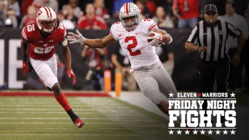 Dec 2, 2017; Indianapolis, IN, USA; Ohio State Buckeyes running back J.K. Dobbins (2) attempts to stay in bounds as he is chased by Wisconsin Badgers cornerback Derrick Tindal (25) in the third quarter in the Big Ten championship game at Lucas Oil Stadium. Mandatory Credit: Mark Hoffman/Milwaukee Journal Sentinel via USA TODAY Sports