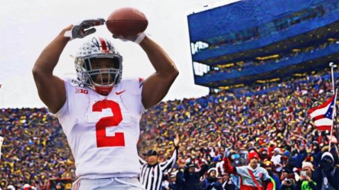 Nov 30, 2019; Ann Arbor, MI, USA; Ohio State Buckeyes running back J.K. Dobbins (2) celebrates after he scores a touchdown in the first half against the Michigan Wolverines at Michigan Stadium. Mandatory Credit: Rick Osentoski-USA TODAY Sports