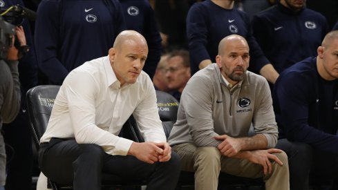 Cael Sanderson (left)