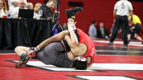 Malik Heinselman pins Minnesota's Patrick McKee at the Big Ten Tournament.