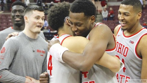 Andre Wesson hugs Duane Washington Jr. on Senior Night.