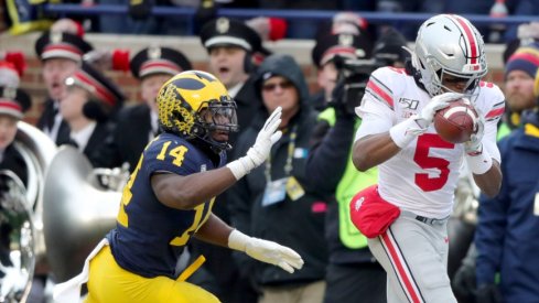 Ohio State Buckeyes receiver Garrett Wilson catches a touchdown pass over Michigan Wolverines safety Josh Metellus during the second half at Michigan Stadium in Ann Arbor, Saturday, Nov. 30, 2019. Sad Michigan football