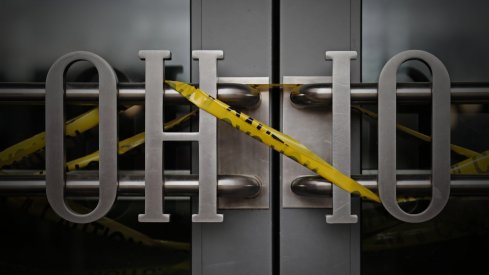 Caution tape was wrapped around the entrance to the Ohio Union on Tuesday, April 14, 2020, at Ohio State University after the campus closed in the spring and classes went online due to the COVID-19 pandemic.