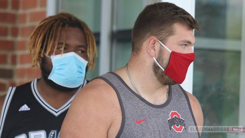 Wyatt Davis and Josh Myers exit the Woody Hayes Athletic Center after the Big Ten canceled fall football.