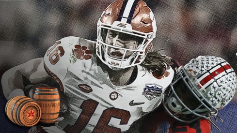 Clemson quarterback Trevor Lawrence, here being tackled by Ohio State cornerback Shaun Wade in the College Football Playoff Semifinal at the Fiesta Bowl in December, is part of a emerging collective of college football stars hoping to play this season.