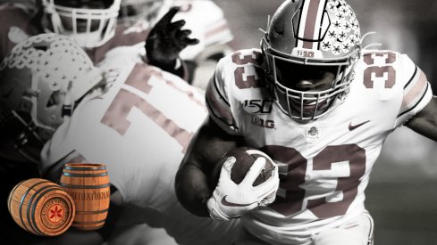 Nov 16, 2019; Piscataway, NJ, USA; Ohio State Buckeyes running back Master Teague III (33) rushes against the Rutgers Scarlet Knights during the second half at SHI Stadium. Mandatory Credit: Noah K. Murray-USA TODAY Sports