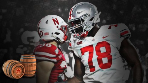 Ohio State tackle Nicholas Petit-Frere greets Nebraska safety Eli Sullivan