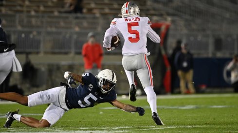 Garrett Wilson runs past Tariq Castro-Fields