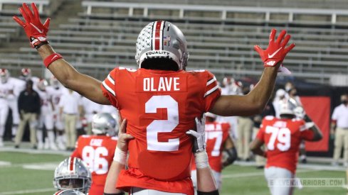 Chris Olave celebrates his touchdown.