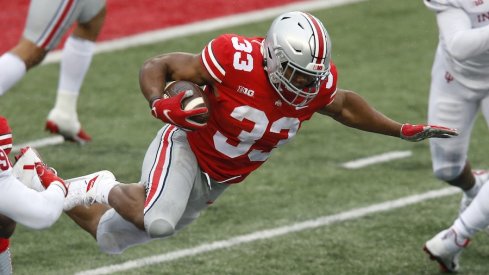 Nov 21, 2020; Columbus, Ohio, USA; Ohio State Buckeyes running back Master Teague III (33) tackled by Indiana Hoosiers defensive back Jamar Johnson (22) during the second quarter at Ohio Stadium. Mandatory Credit: Joseph Maiorana-USA TODAY Sports