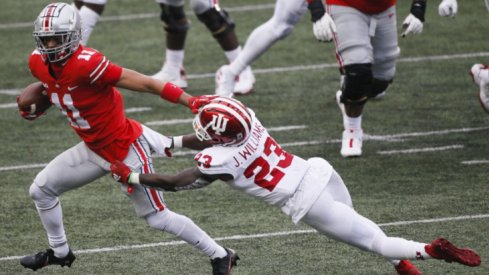 Ohio State Buckeyes wide receiver Jaxon Smith-Njigba (11) shakes off Indiana Hoosiers defensive back Jaylin Williams (23) as he fights for yards after a completion during the second quarter of a NCAA Division I football game between the Ohio State Buckeyes and the Indiana Hoosiers on Saturday, Nov. 21, 2020 at Ohio Stadium in Columbus, Ohio. Cfb Indiana Hoosiers At Ohio State Buckeyes