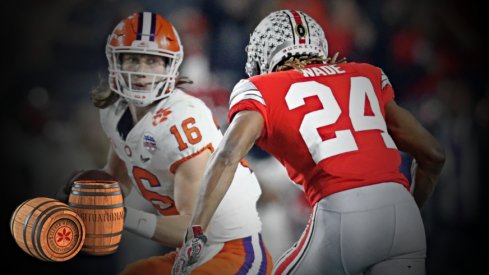 Dec 28, 2019; Glendale, AZ, USA; Ohio State Buckeyes cornerback Shaun Wade (24) tackles Clemson Tigers quarterback Trevor Lawrence (24) in the 2019 Fiesta Bowl college football playoff semifinal game at State Farm Stadium. Wade would be ejected from the game for targeting. Mandatory Credit: Mark J. Rebilas-USA TODAY Sports