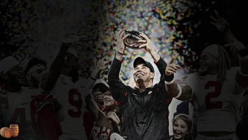 Ohio State Buckeyes head coach Ryan Day raises the Stagg Championship Trophy along with Ohio State Buckeyes wide receiver K.J. Hill Jr. (14), Ohio State Buckeyes wide receiver Binjimen Victor (9) and Ohio State Buckeyes defensive end Chase Young (2) following the Buckeyes' 34-21 victory against the Wisconsin Badgers during the Big Ten Football Championship Game on Saturday, December 7, 2019 at Lucas Oil Stadium in Indianapolis, Indiana. [Joshua A. Bickel/Dispatch]