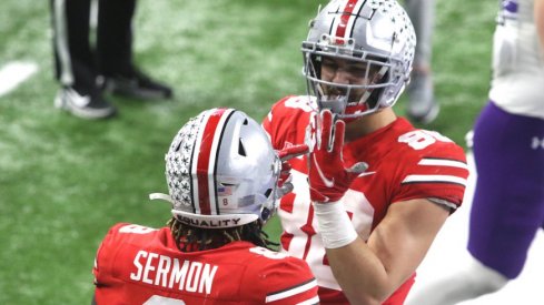 Ohio State football players Trey Sermon and Jeremy Ruckert celebrate a Big Ten championship