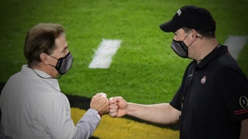 Jan 11, 2021; Miami Gardens, FL, USA; Alabama Crimson Tide head coach Nick Saban (left) greets Ohio State Buckeyes head coach Ryan Day before the 2021 College Football Playoff National Championship Game at Hard Rock Stadium. Mandatory Credit: Douglas DeFelice-USA TODAY Sports