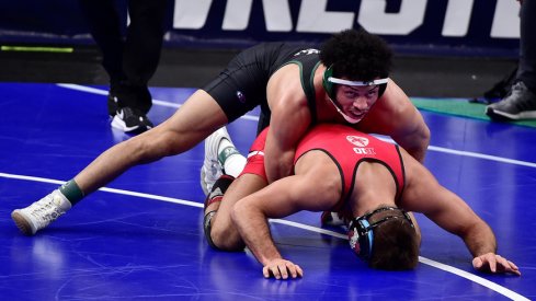 Utah Valley's Demetrius Romero wrestles Ohio State's Kaleb Romero during the NCAA quarterfinals.