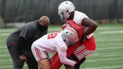 Ohio State players practice tackling