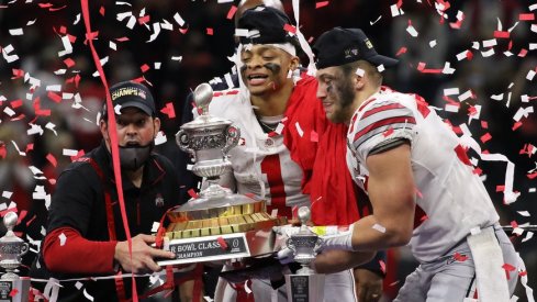 Buckeyes lift a trophy after a bowl win against Clemson
